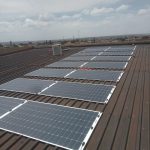 Solar panels installed across a corrugated metal roof