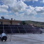 Rooftop solar PV panels installed on a flat concrete roof in Johannesburg