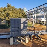 Containerised unit being positioned on a prepared steel base frame